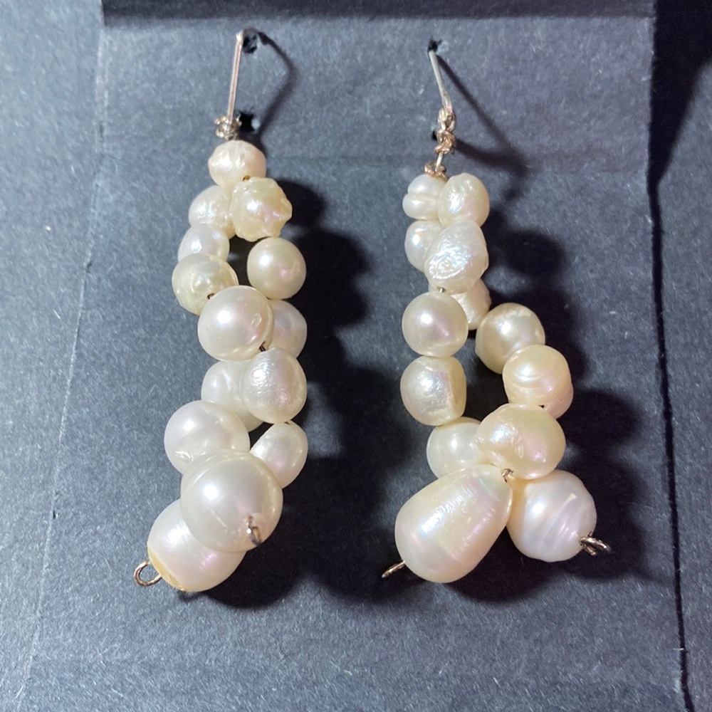 White fresh water pearls double strand twisted dangling earrings.